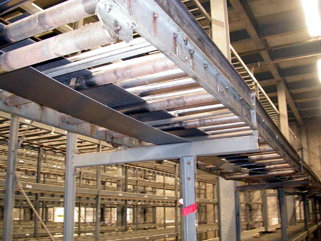 conveyor mounted onto racking